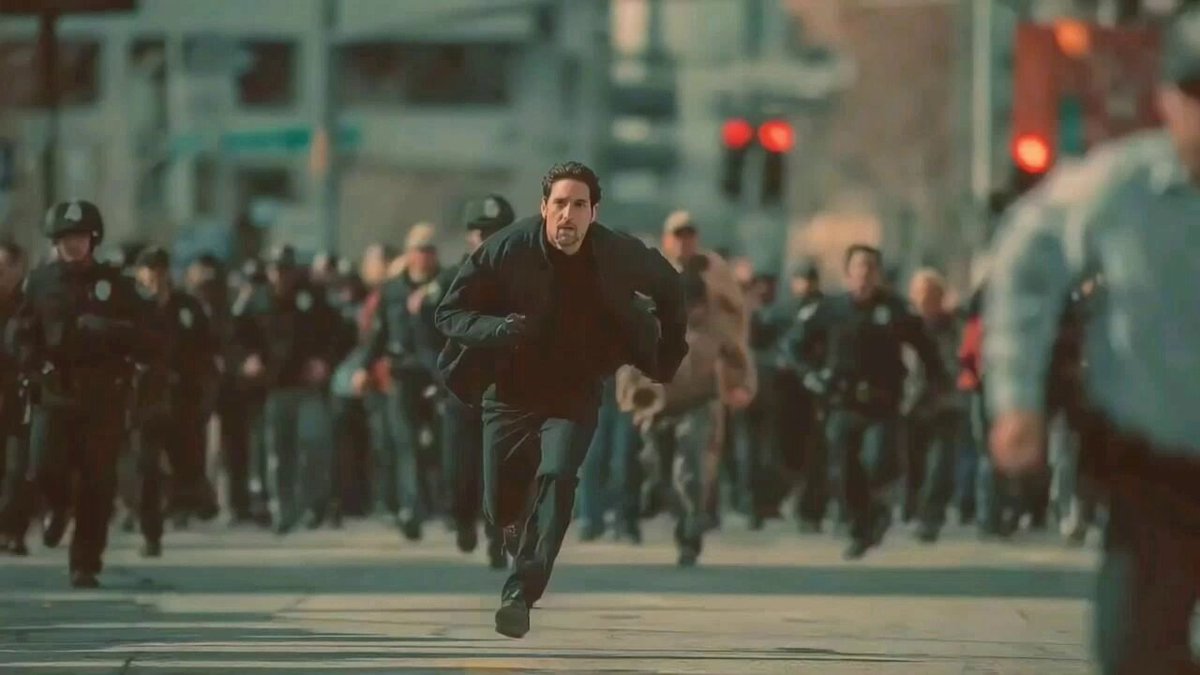 Man Fleeing Police in Urban Chase Scene